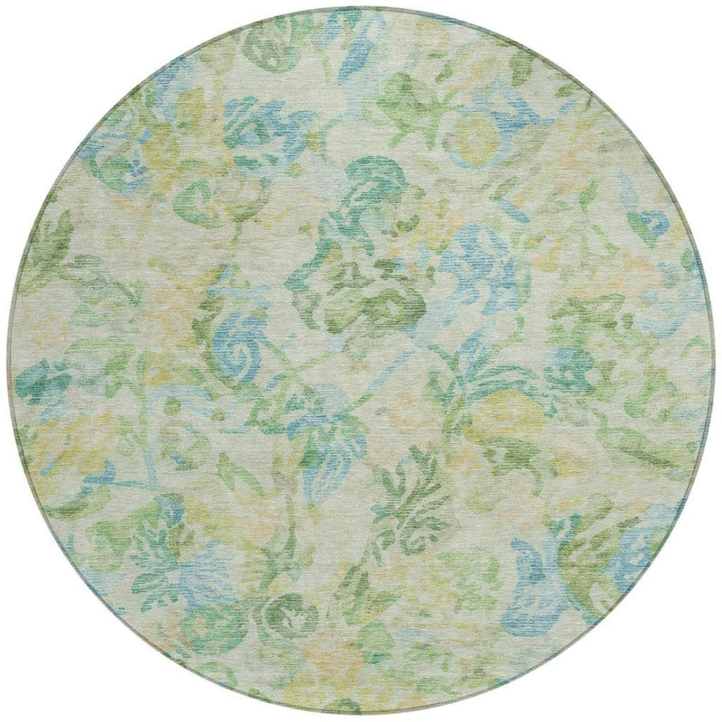 Round decorative rug with pastel blue, green, and yellow botanical pattern