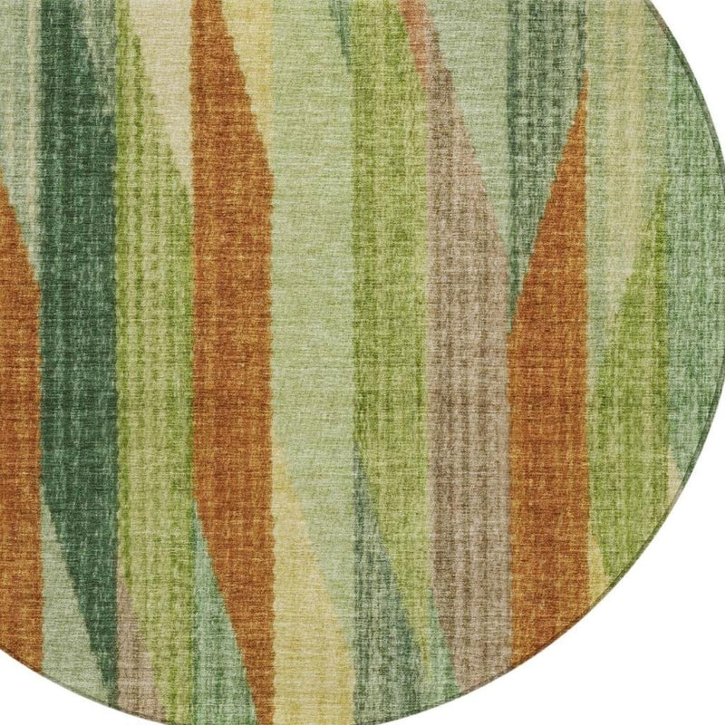 Round rug edge with green, brown, and cream vertical stripe pattern