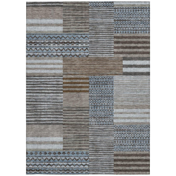 Patchwork area rug with brown, gray, white stripes and blue geometric border