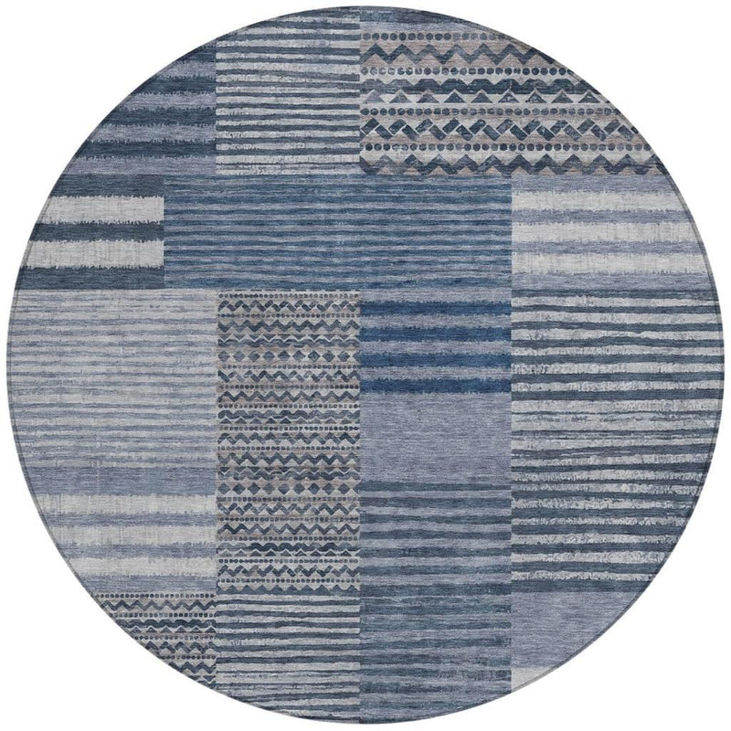 Blue and gray round area rug with horizontal stripes and central geometric block