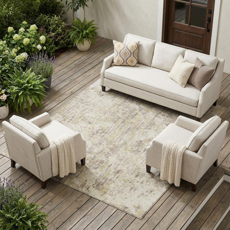 Ivory and silver abstract area rug on wood deck, rectangular pattern