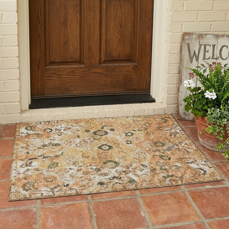 Floral area rug with beige field and copper orange tones, dark green and black motifs