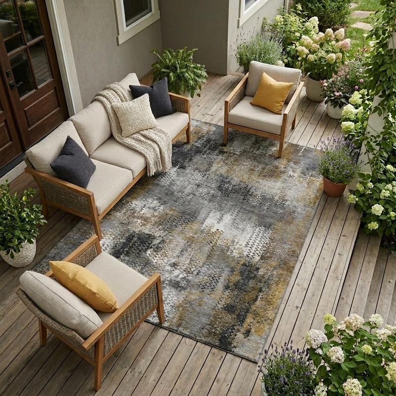 Gray and graphite abstract area rug with patchwork texture, corner visible