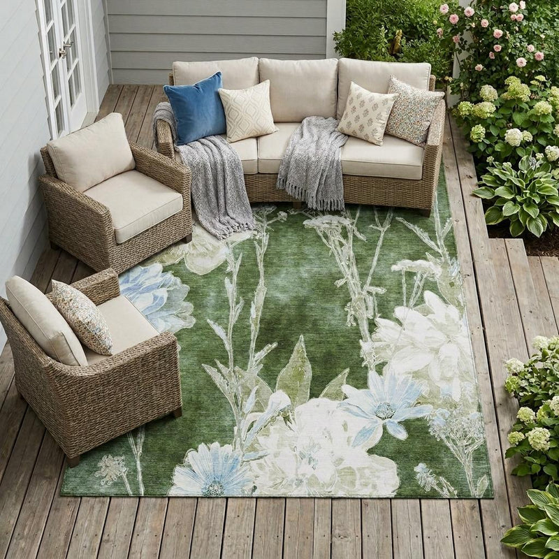 Green indoor outdoor area rug on deck with ivory and light blue floral design