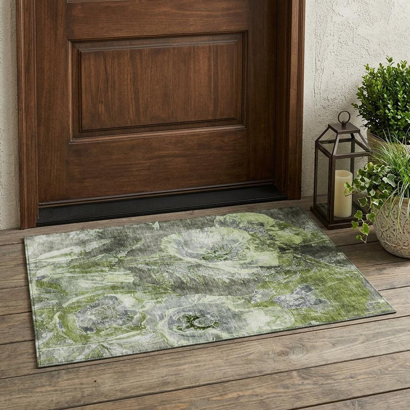 Green and silver floral area rug with decorative border.