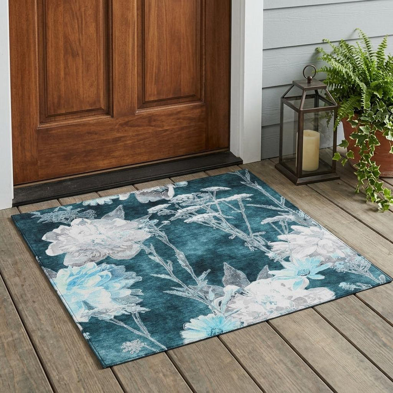 Floral indoor outdoor rug, dark teal background with light blue and white flowers