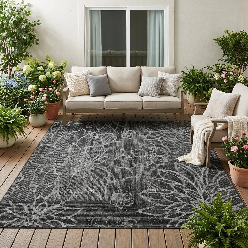 Graphite and black floral patterned area rug with textured, washable weave