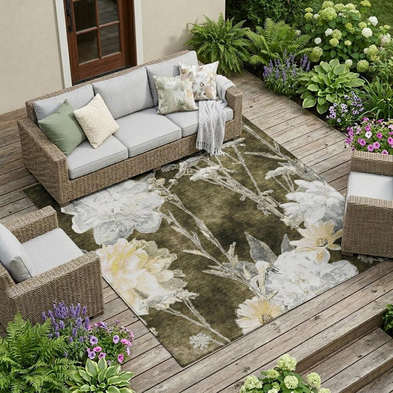 Floral indoor/outdoor area rug with white and pale yellow flowers on dark brown
