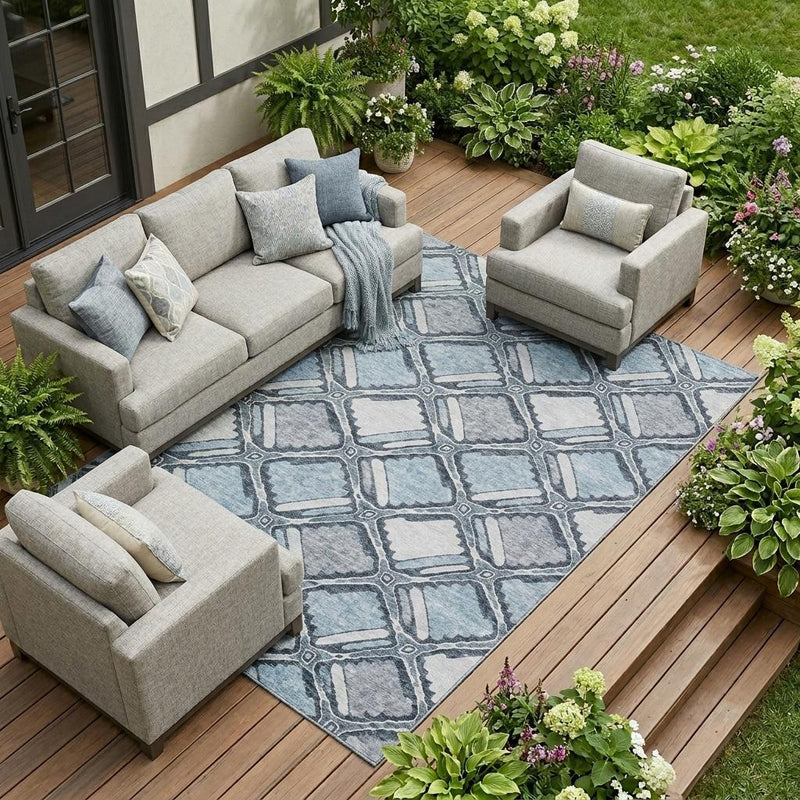 Blue and gray geometric washable area rug on outdoor deck