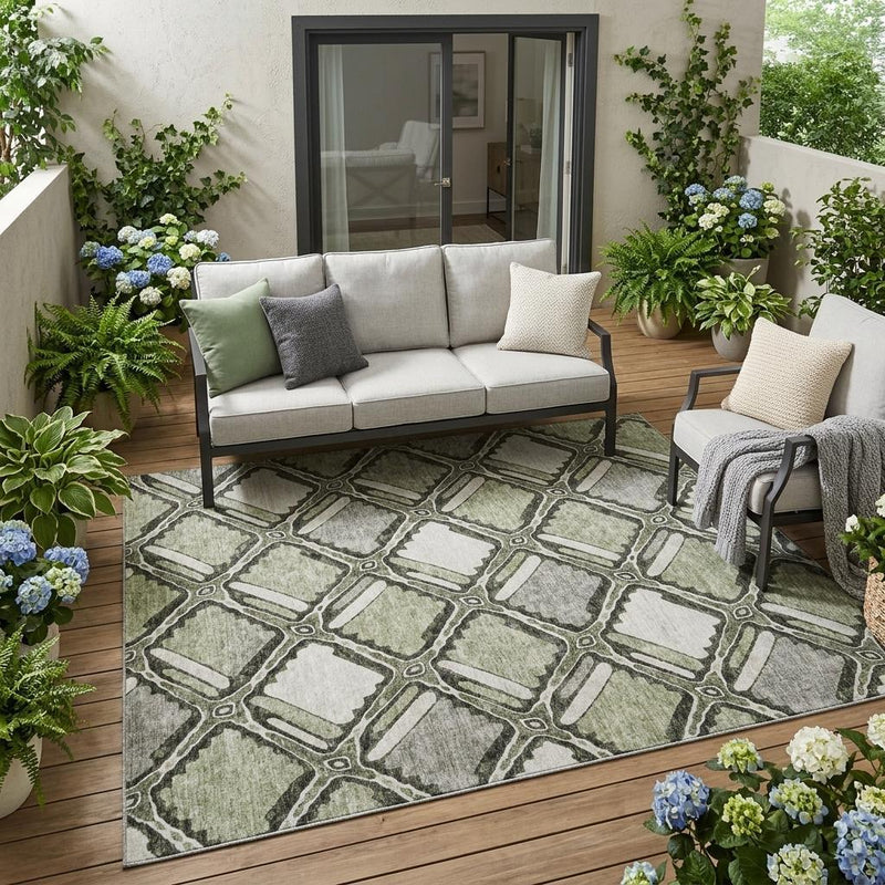 Sage and green geometric area rug placed on outdoor patio flooring