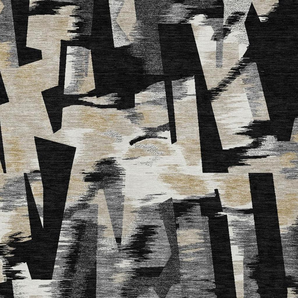 Abstract area rug close-up texture with black and graphite shapes over beige fibers.