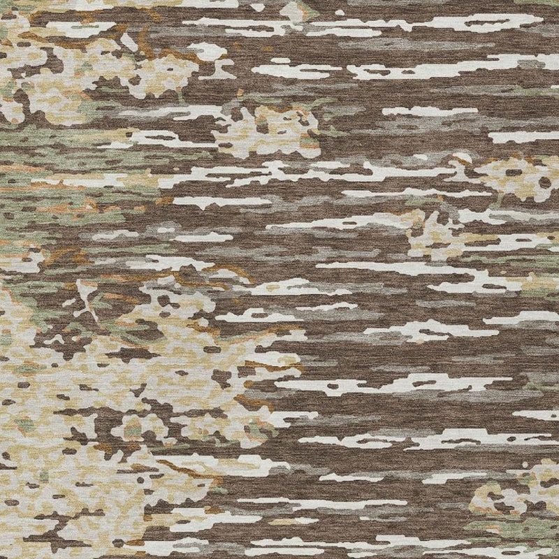 Abstract wash area rug texture close-up with brown, cream, gray, and muted olive pattern.