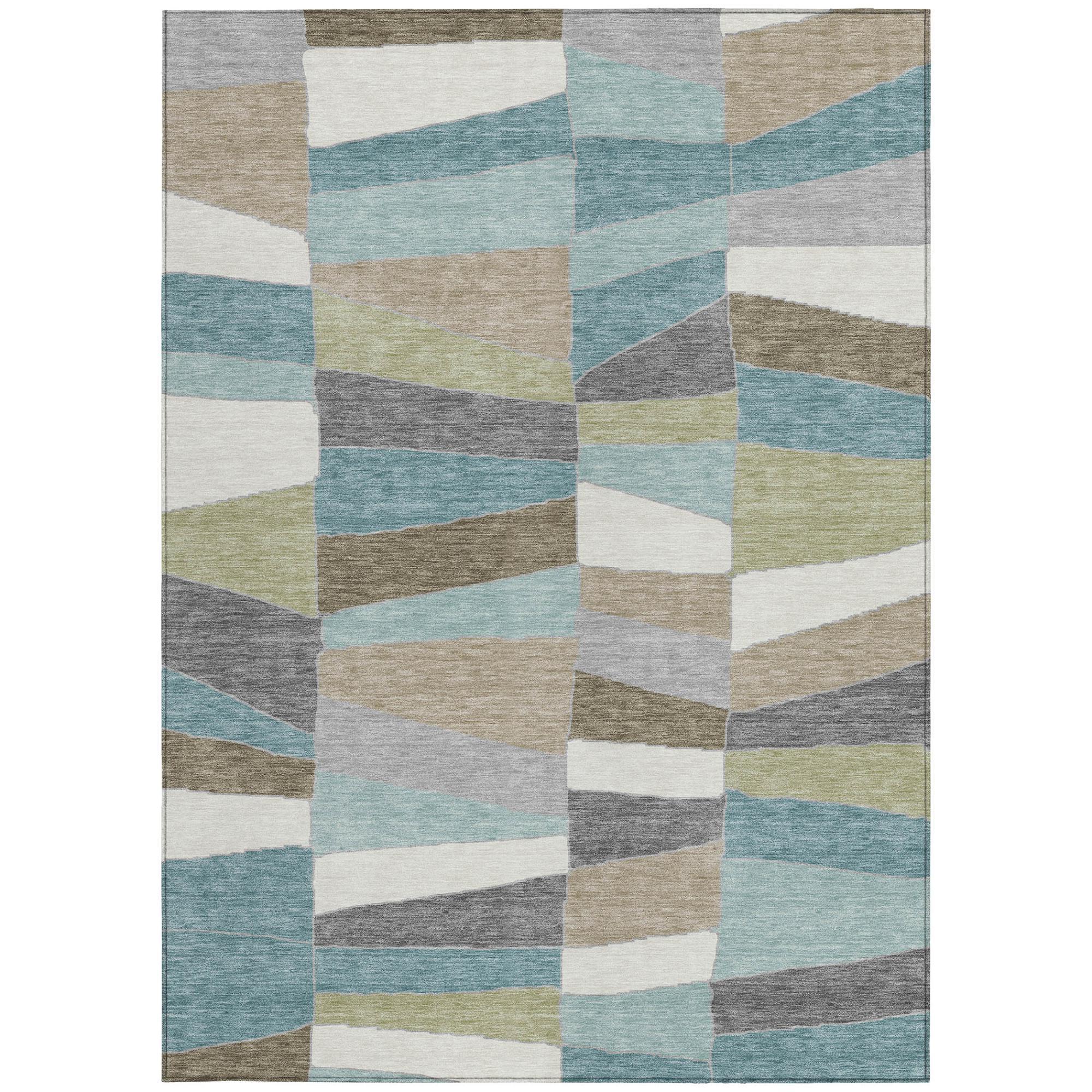 Geometric area rug with teal, beige, gray, and white block patchwork pattern