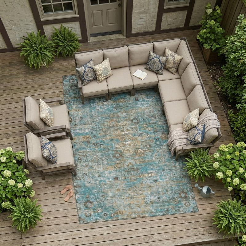 Teal blue and pewter floral medallion area rug on outdoor patio with furniture