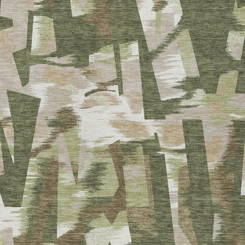 Pattern detail of olive green abstract area rug with cream geometric blocks and mottled finish.