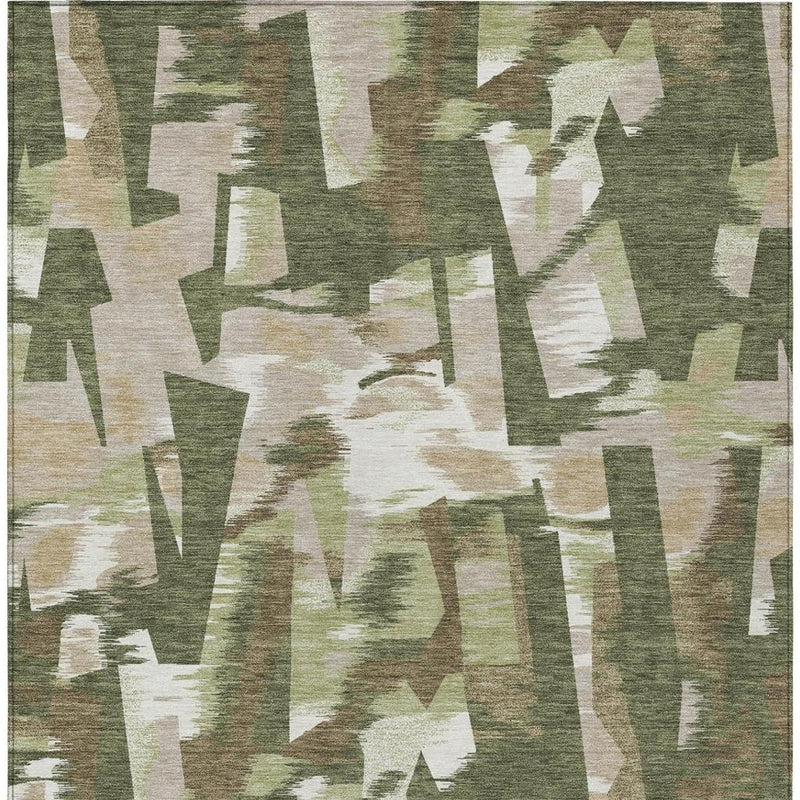 Abstract area rug in olive green with cream and muted tan geometric blocks across surface.