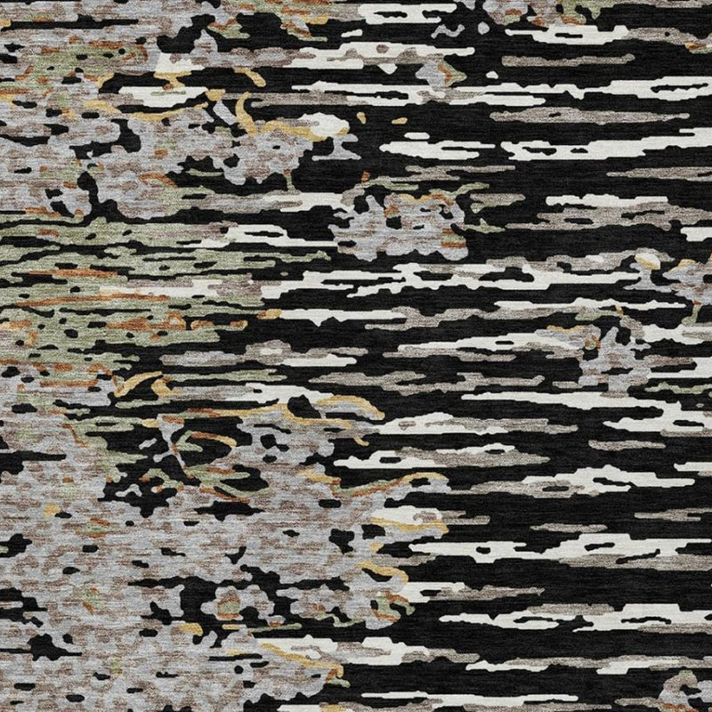 Abstract area rug with black, gray, and graphite horizontal blocks and speckled texture