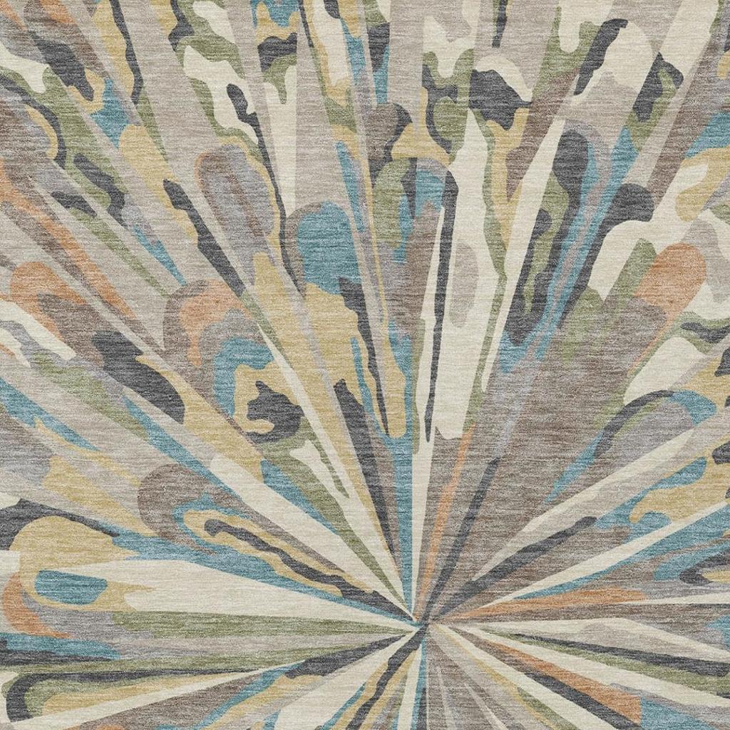 Abstract area rug centered burst pattern in beige with blue, green, tan, and gray accents