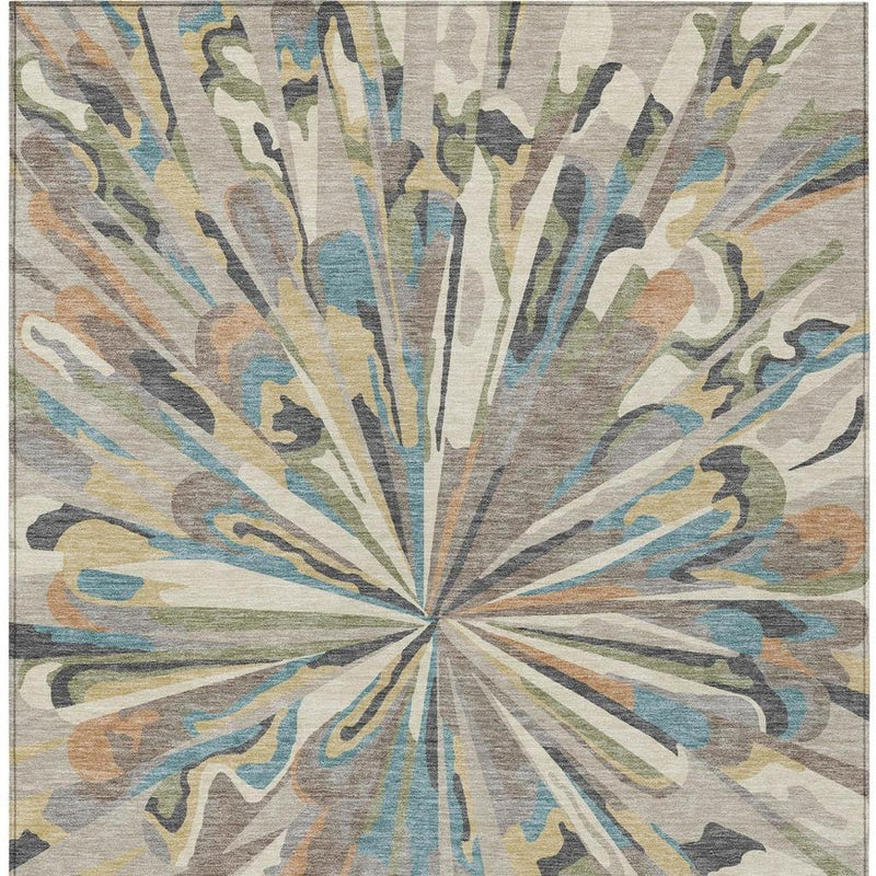 Abstract area rug with radial sunburst pattern in beige, blue, green, tan, and gray