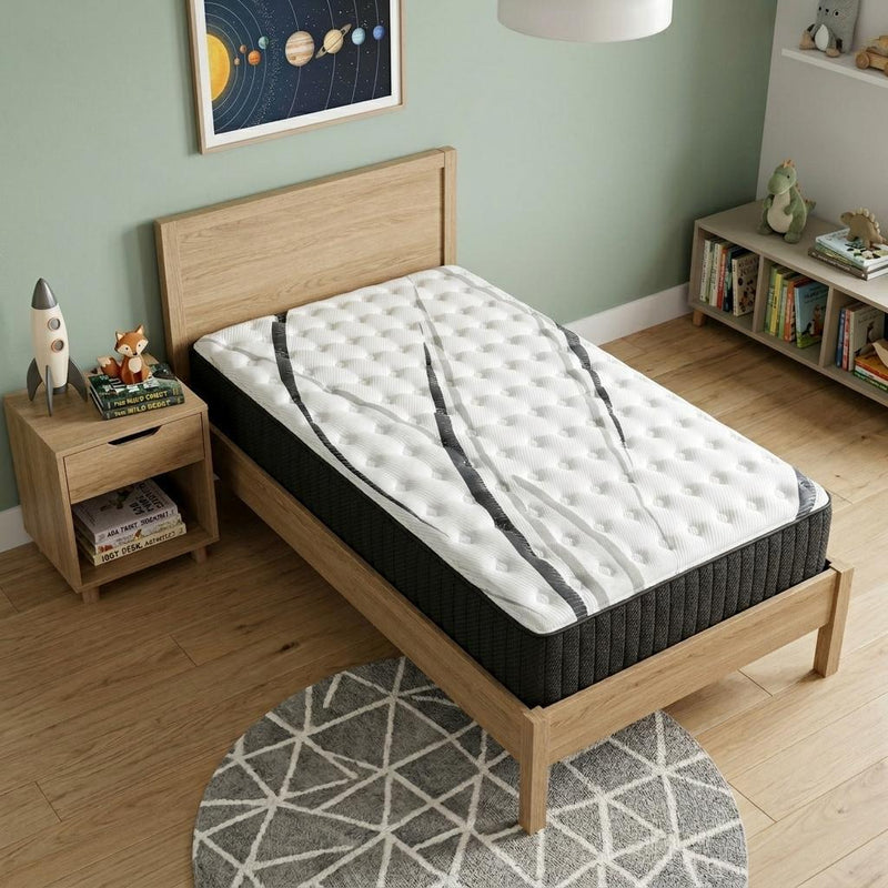 Twin hybrid mattress with white quilted top and dark charcoal fabric sides on wooden frame