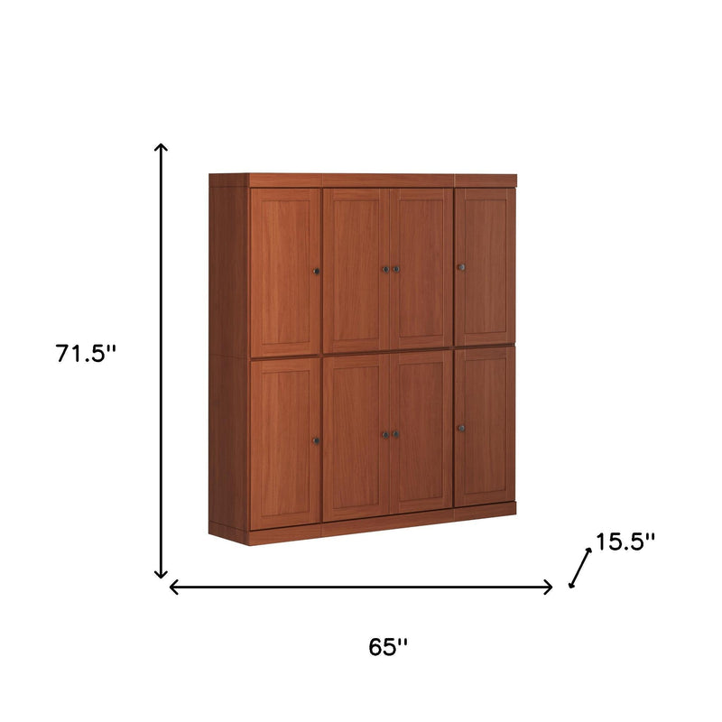 Brown wood pantry storage cabinet with paneled door fronts and flat top