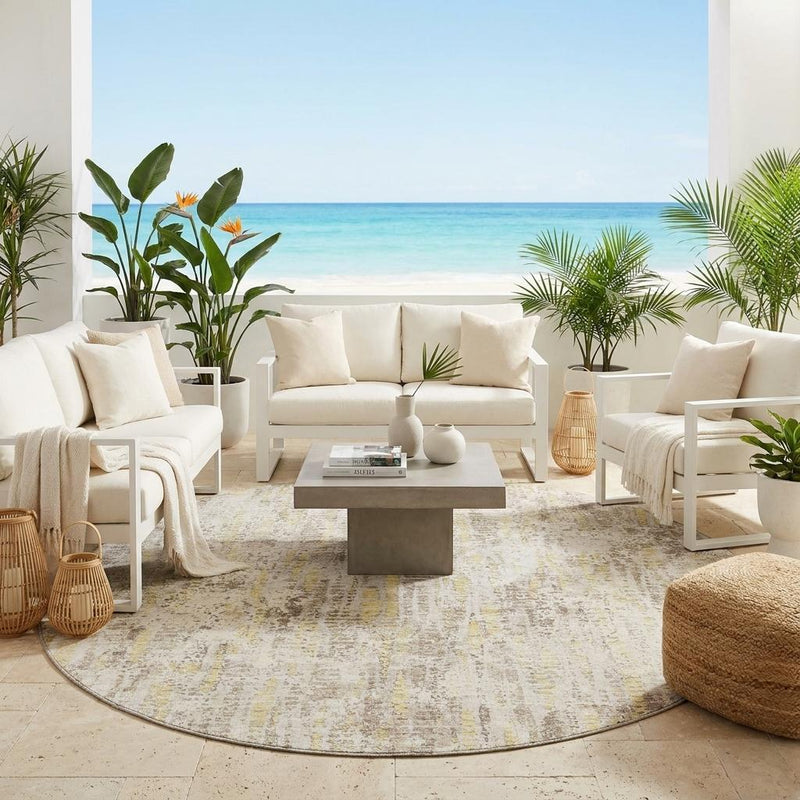 Round ivory and silver abstract area rug with circular design on floor