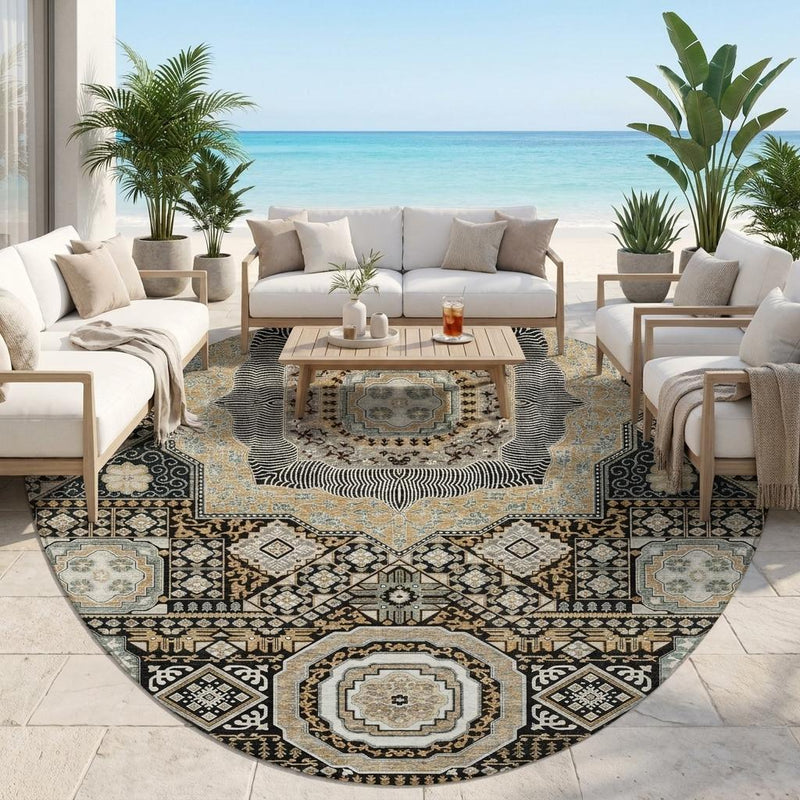 Round area rug with black, ivory, and blue medallion motifs in a living room setting
