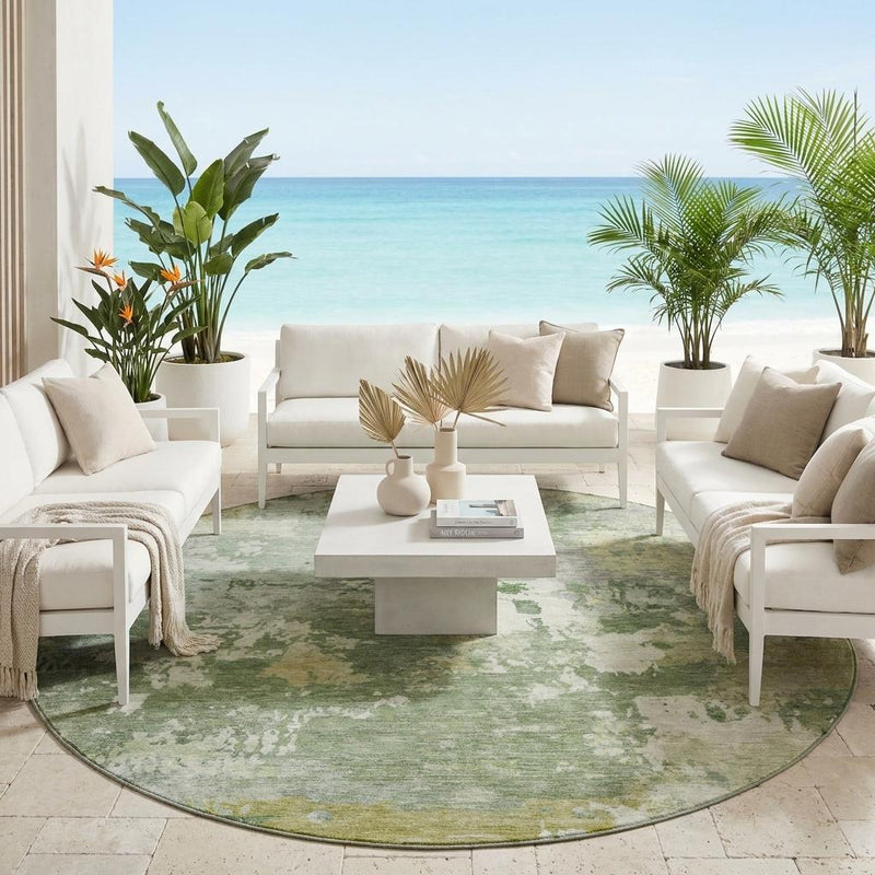Round green-and-beige abstract area rug with distressed print