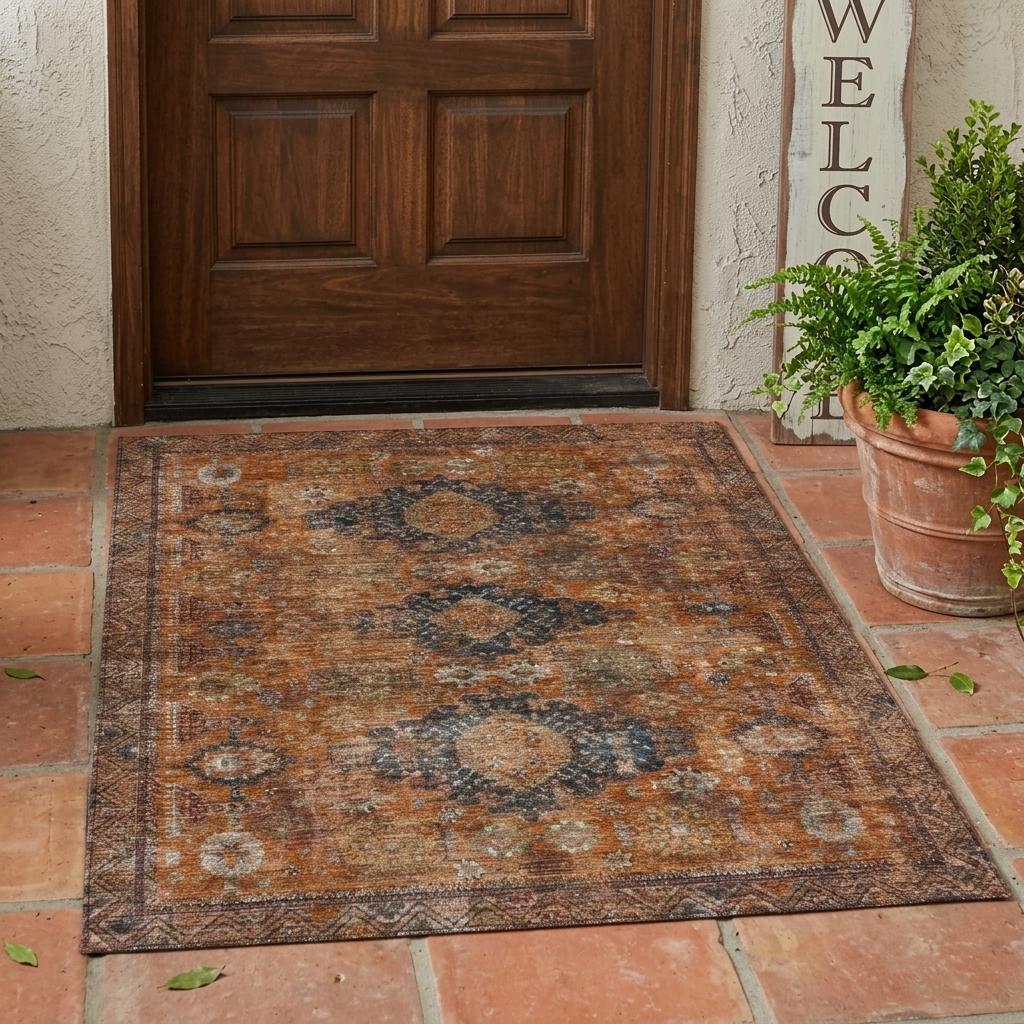 Vintage-style orange and blue area rug, made of durable material, perfect for entryway or patio decor.