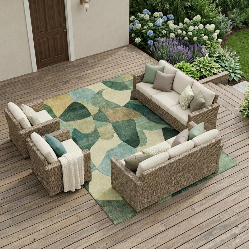 Rectangular abstract area rug in green and beige with wavy block pattern