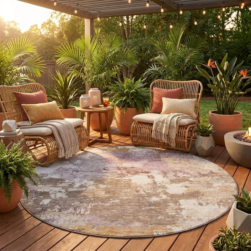 Round abstract outdoor area rug with beige base and brown blush worn look