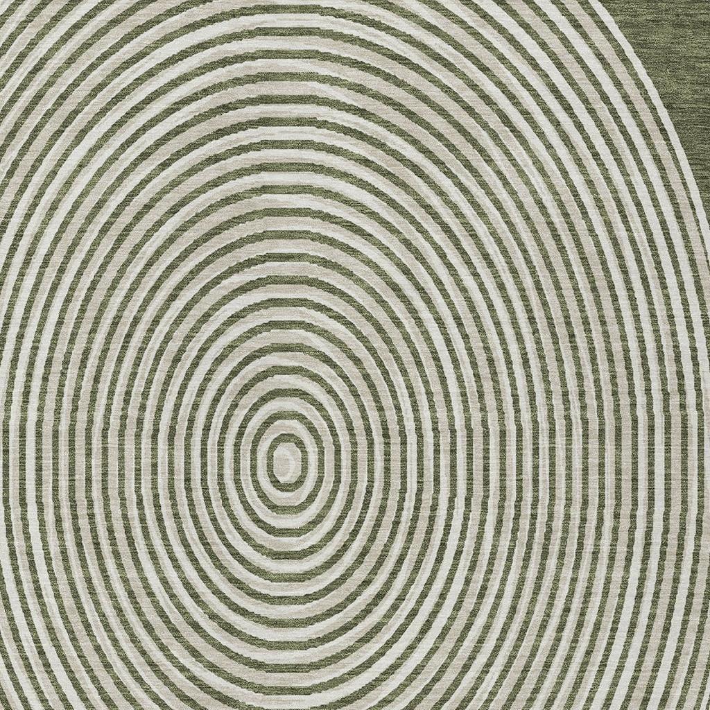 Circular green and cream geometric area rug, featuring concentric stripes in a modern, stylish design.