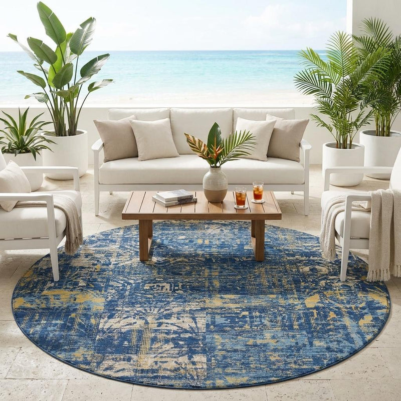Round blue and navy abstract area rug with distressed texture and patterned border