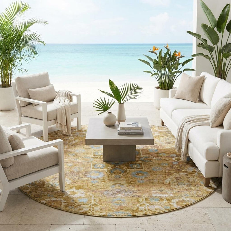 Round area rug with gold and copper medallion floral design and light blue accents