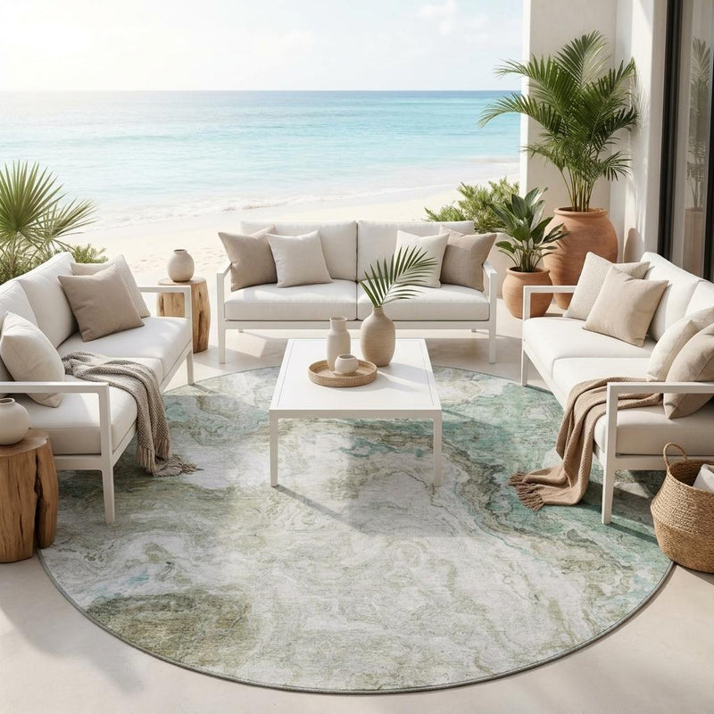 Round abstract area rug, pale beige with muted teal patches