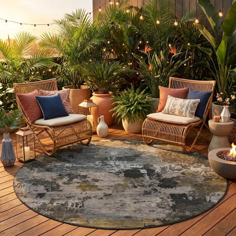Round abstract area rug centered on outdoor deck, gray pewter with tan highlights