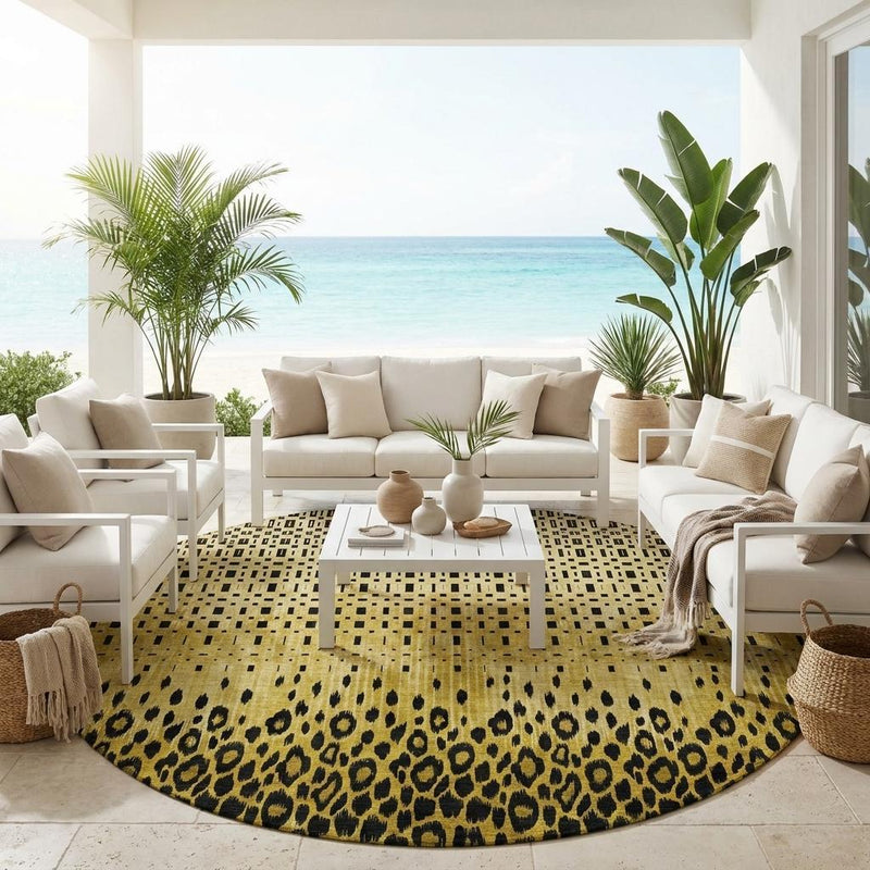 Round indoor/outdoor area rug with gold and dark leopard-style print on the floor.