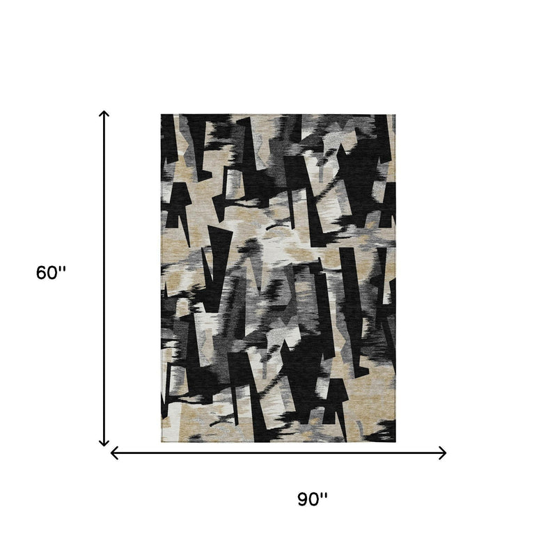 Abstract area rug with black and graphite shapes on light beige ground, rectangular.