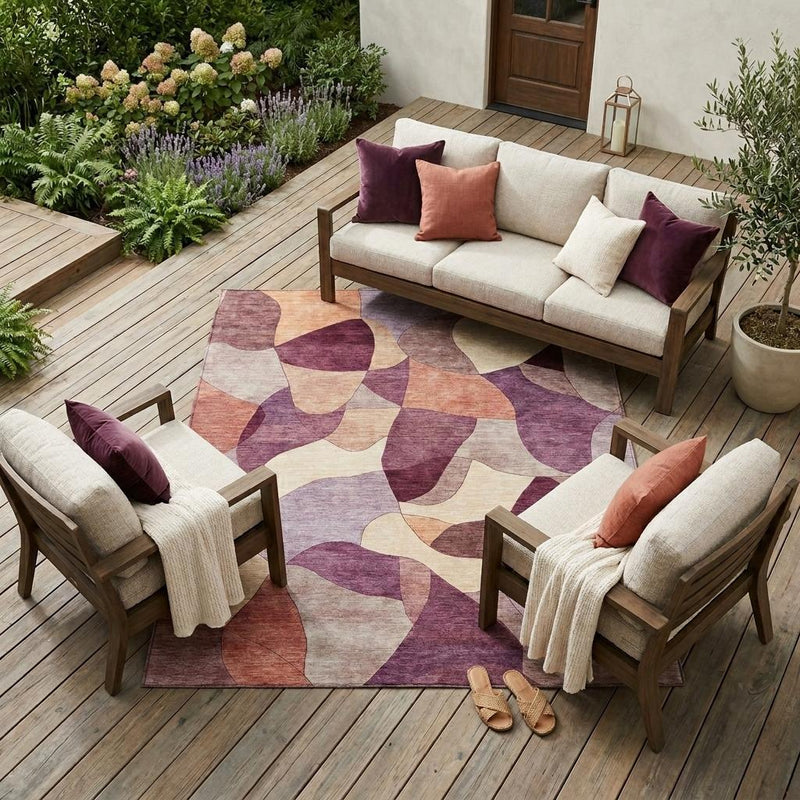 Abstract area rug with maroon and beige geometric shapes on outdoor deck