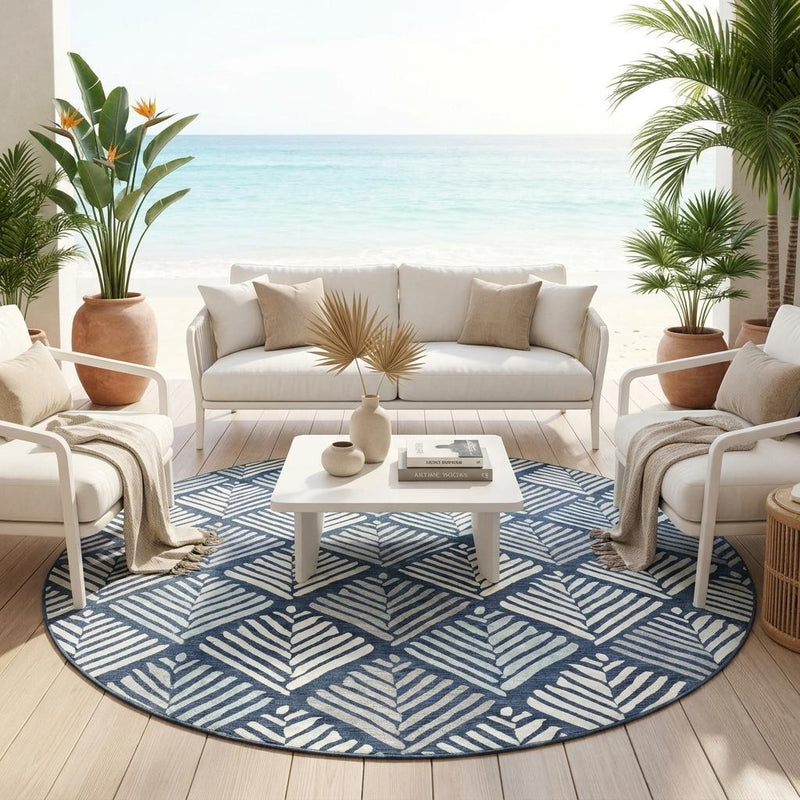 Navy and light-blue geometric leaf round area rug in an indoor seating space