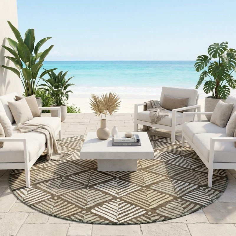 Round area rug with brown and cream leaf-and-stripe geometric pattern