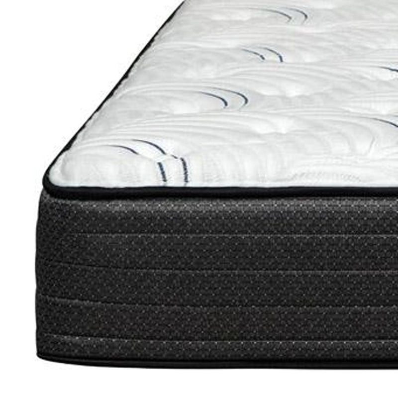 Edge closeup of RV king mattress showing dark textured foam layers