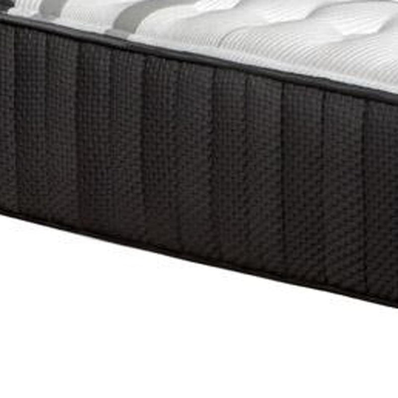 Dark charcoal mattress side panel with vertical stitching and white quilted top edge