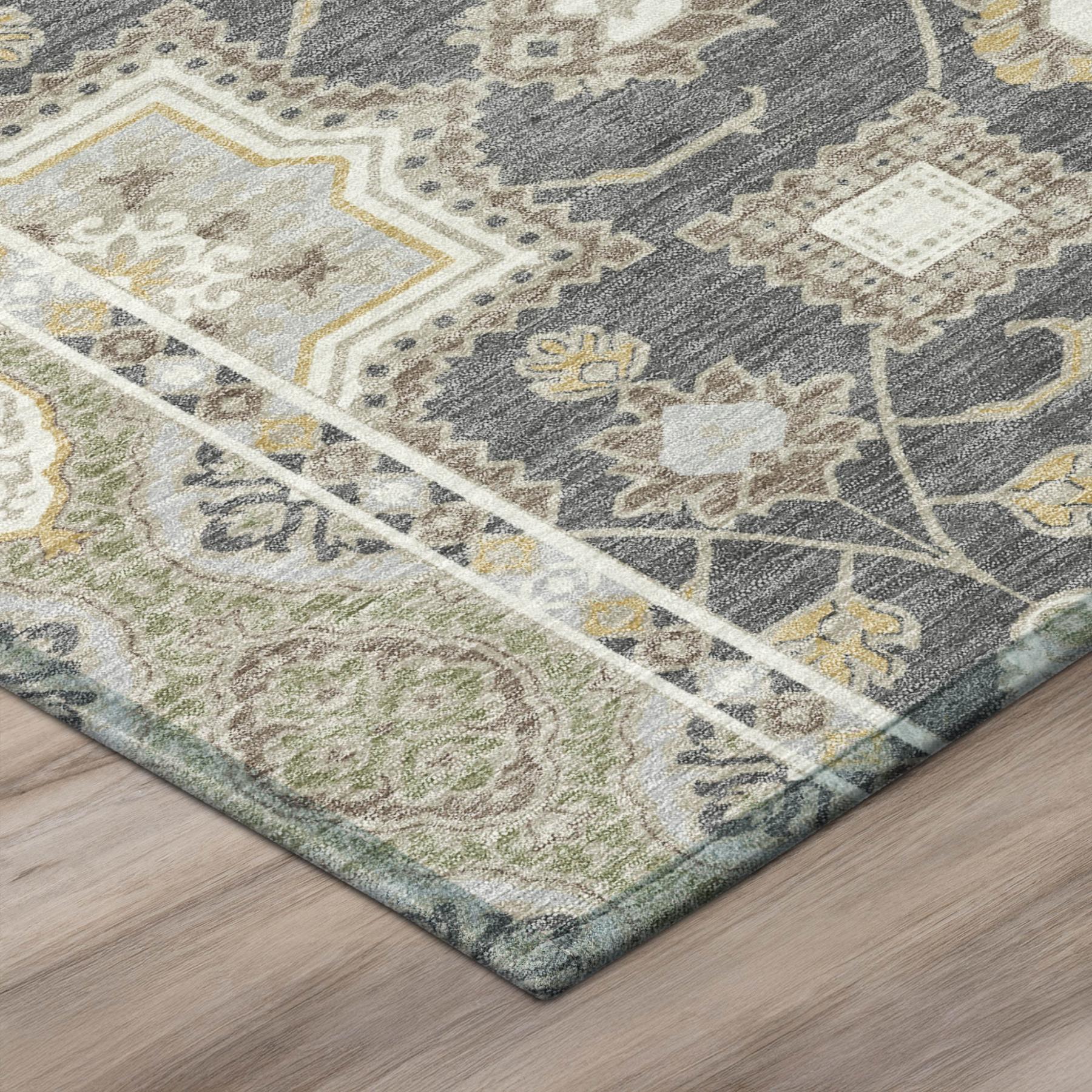 Corner detail of graphite and gray floral medallion area rug with woven border