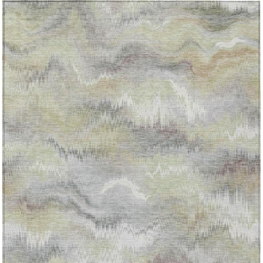 Abstract area rug with cloud-like watercolor design in ivory, green, and gray tones
