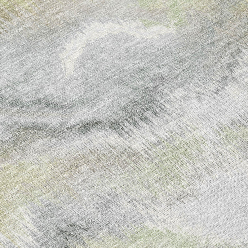 Abstract area rug texture with light ivory base and subtle green wash marks