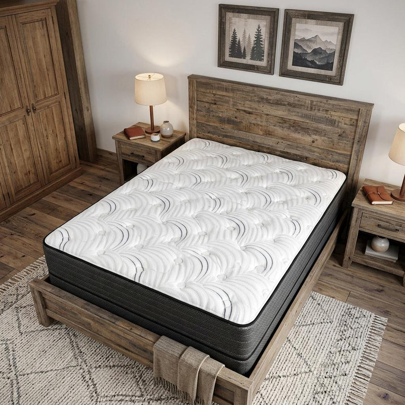 Full hybrid mattress with white comfort top and black sides on a bed frame.