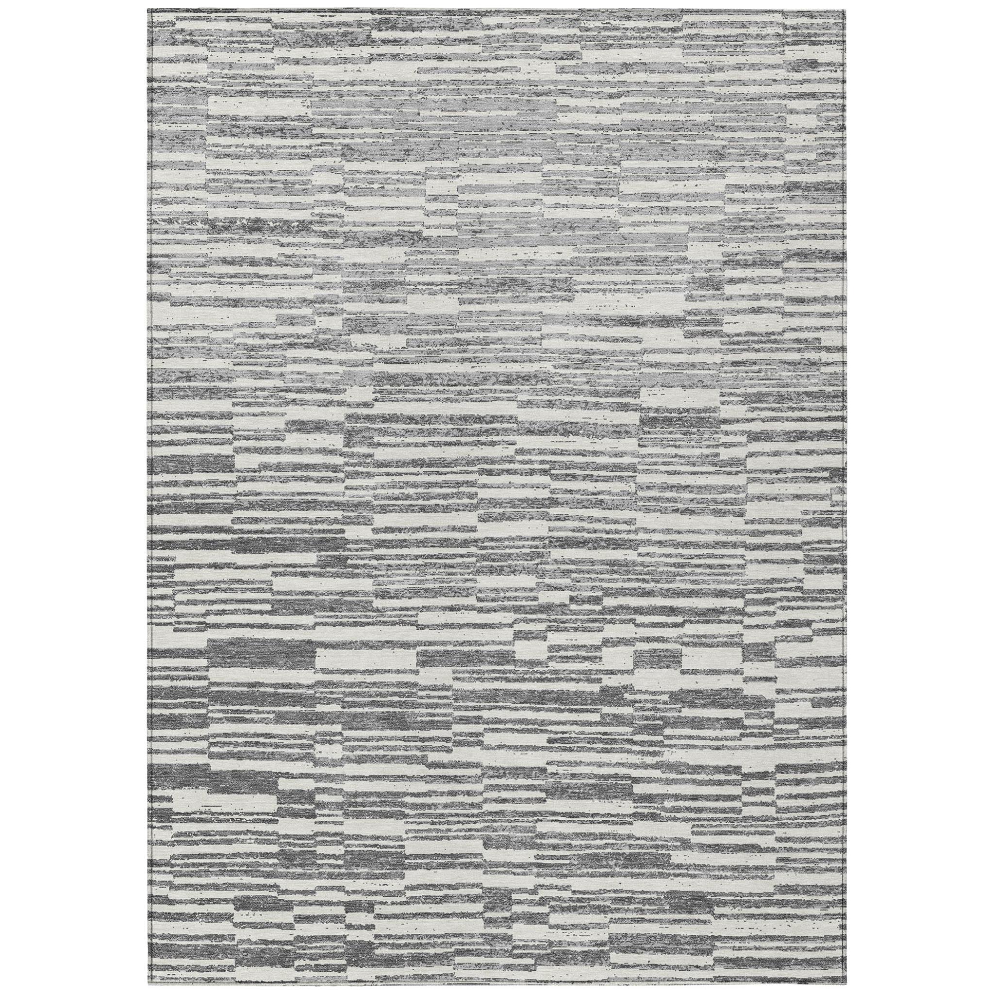 Rectangular graphite and gray striped area rug with distressed, mottled texture