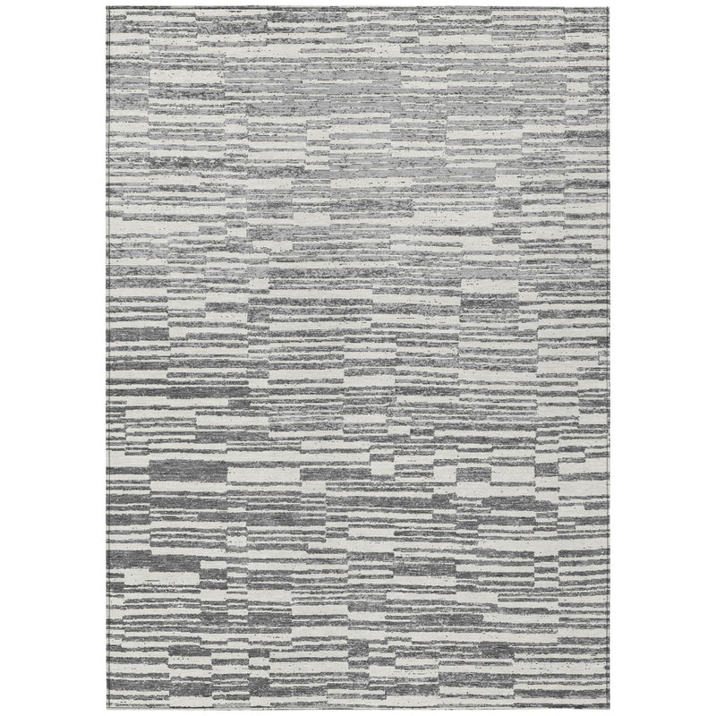 Rectangular graphite and gray striped area rug with distressed, mottled texture