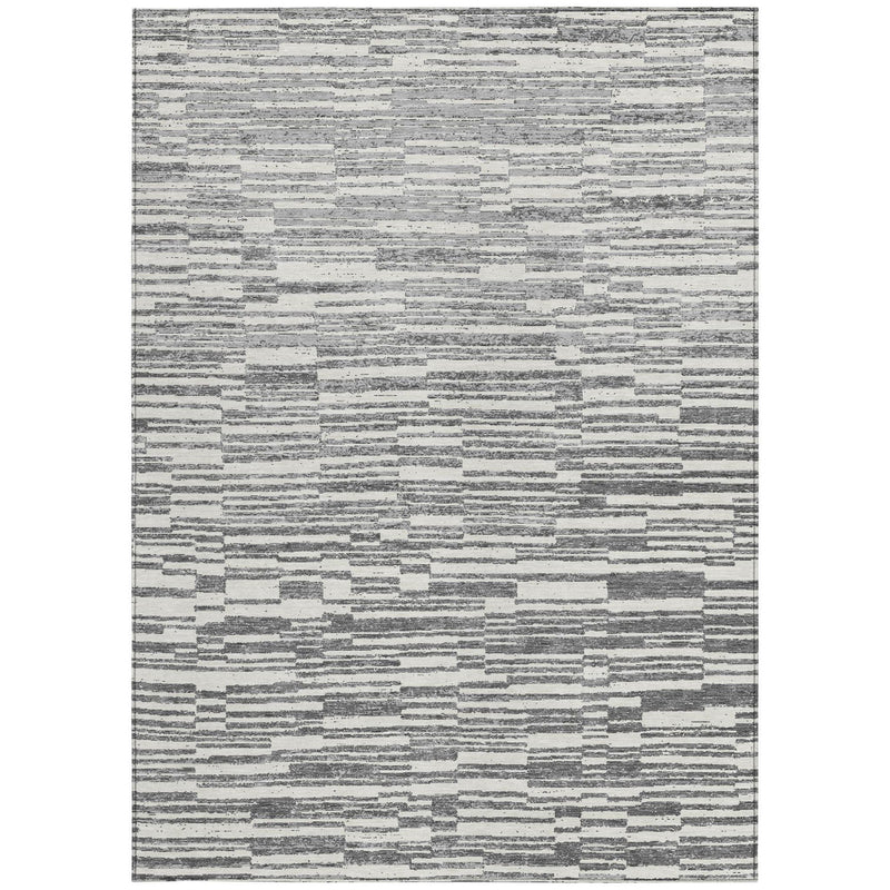 Rectangular light gray and graphite striped area rug with speckled distress